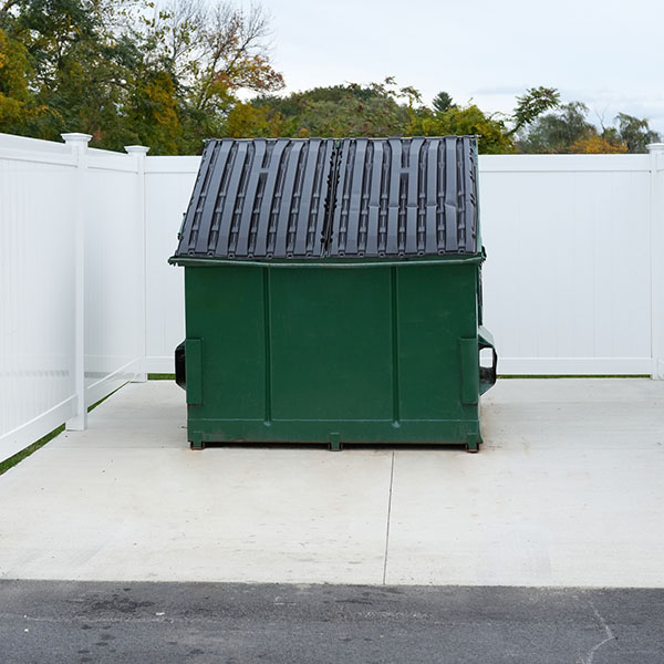 large green commercial dumpster for trash and recycling
